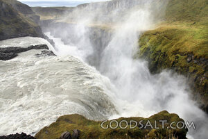 Roaring Waterfall in a Misty Canyon