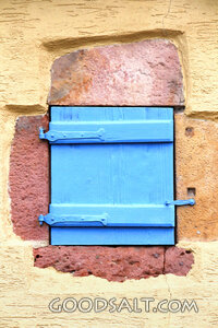 Closed Shutter in an Old Stone Wall