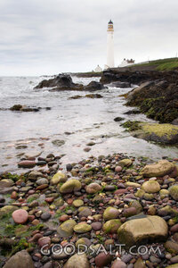 Lighthouse on the Rocky Shore