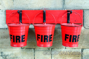 Red Fire Buckets on Stone Wall