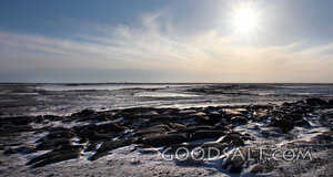 Sun Over the Rocky Shore