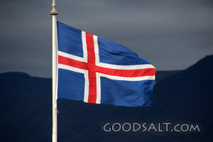 Icelandic Flag Over Mountain Highlands
