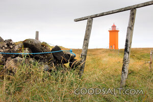 Lighthouse Beyond the Weathered Gate