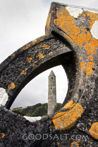 Celtic Cross Framing a Round Tower