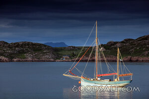 Sailboat at Rest Beneath Storm Clouds