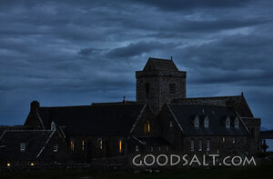 Stone Church Under Storm Clouds