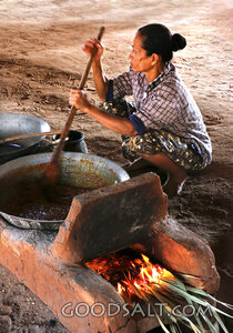 Woman Cooking Over an Open Hearth