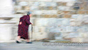 Elderly Woman Walking with a Cane