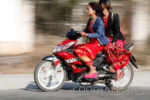 Two Women Riding a Motorbike
