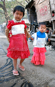 Children Walking Through a Village