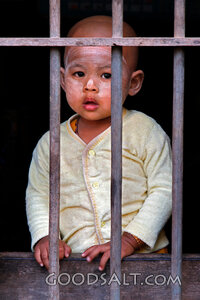 Child Behind the Wooden Bars