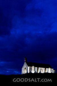 Chapel Light Beneath the Night Sky