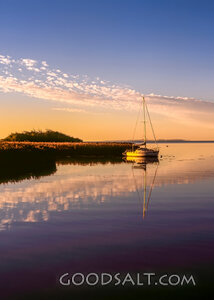 Sailboat on Still Waters at Sunset