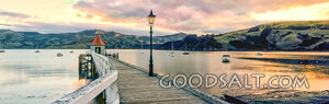 Pier Over Still Waters at Sunset
