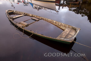 Empty Fisherman’s Boat in Still Waters