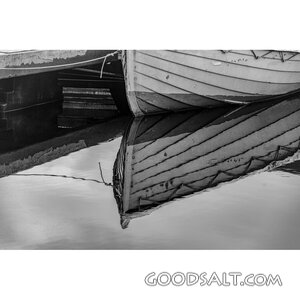 Harbor Reflection of a Wooden Boat