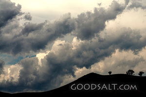 Hills Beneath Gathering Storm Clouds