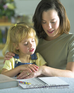Mother Teaching Her Daughter at Home