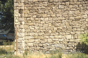 Stone Wall with Speed Limit Sign
