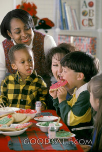 Children Sharing Decorated Cookies