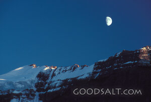 Moon Over Snow-Capped Mountains