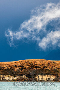 Wispy white cloud hovering.