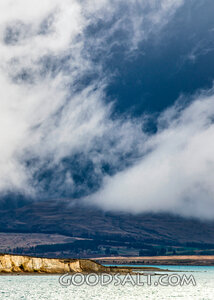 Wispy white cloud hovering.