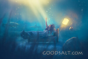Woman at bottom of sea reaching for help