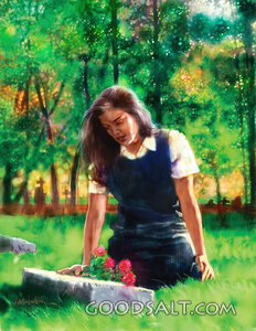 Woman Lays Flowers at Gravesite