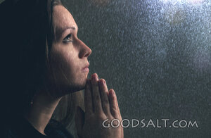 Woman Prays in Rain