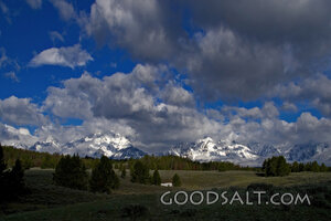 WYOMING. Teton National Park. Clouds over Tetons and prarie.