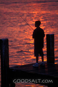 Boy Fishing at Sunset