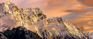dramatic mountain range with snow and rock.