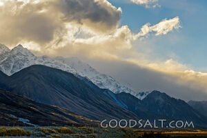 early morning sky over huge snow-clad peak