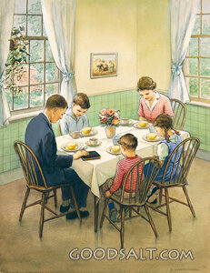 Family Saying Grace at Breakfast