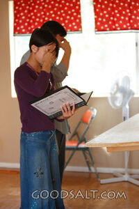 Girl and Hebrew tutor practicing the Shema prayer.