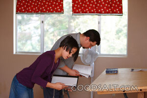 Girl and Hebrew tutor practicing the tefellin prayer.