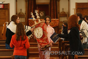 IDAHO. Boise. Asian Jewish girl carrying Torah for Hakifah i