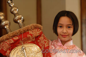 IDAHO. Boise. Asian Jewish girl holding Torah scrolls in syn