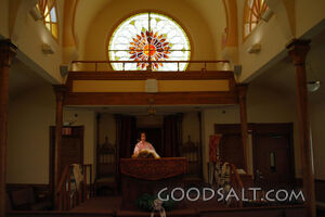 IDAHO. Boise. Asian Jewish girl standing at bimah in Ahavath