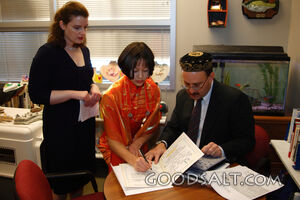 IDAHO. Boise. Rabbi with Asian Jewish girl and her mother si