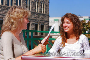 IDAHO. Boise. Two women seated in outdoor café, talking. MR