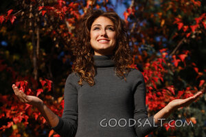 IDAHO. Boise. Young woman lifting hands in worship.  MR