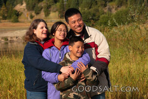 IDAHO. Smith’s Ferry. Happy family outdoors on autumn mornin