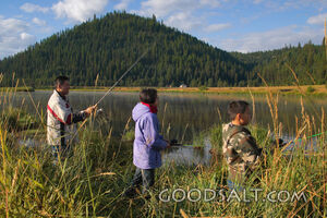IDAHO. Smith’s Ferry. Man and kids fishing on autumn morning