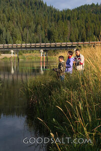 IDAHO. Smith’s Ferry. Man and kids fishing on autumn morning