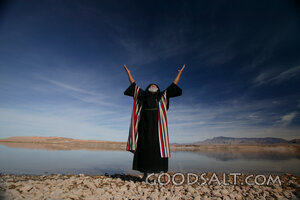 Isrealite Man at Water's Edge With Hand's Raised