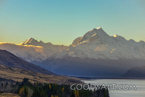 Prominent mountain range behind lake waters.