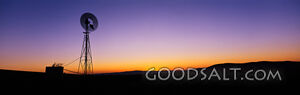 Silhouetted Windmill at Sunset