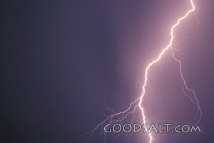 A flash of lightning in a dark sky.